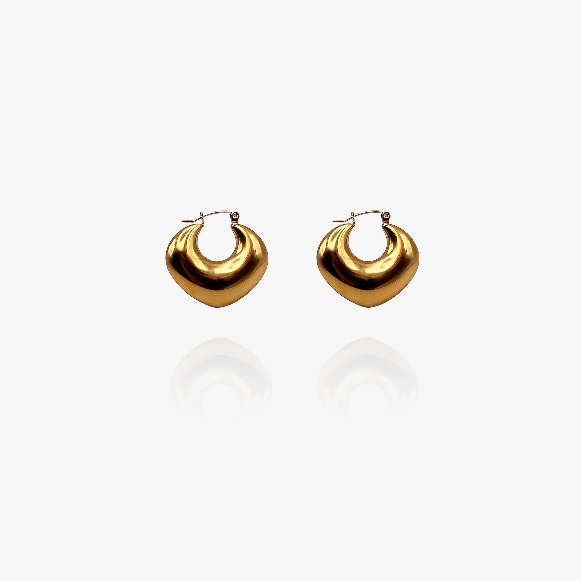 Pair of gold hoop earrings on a white background
