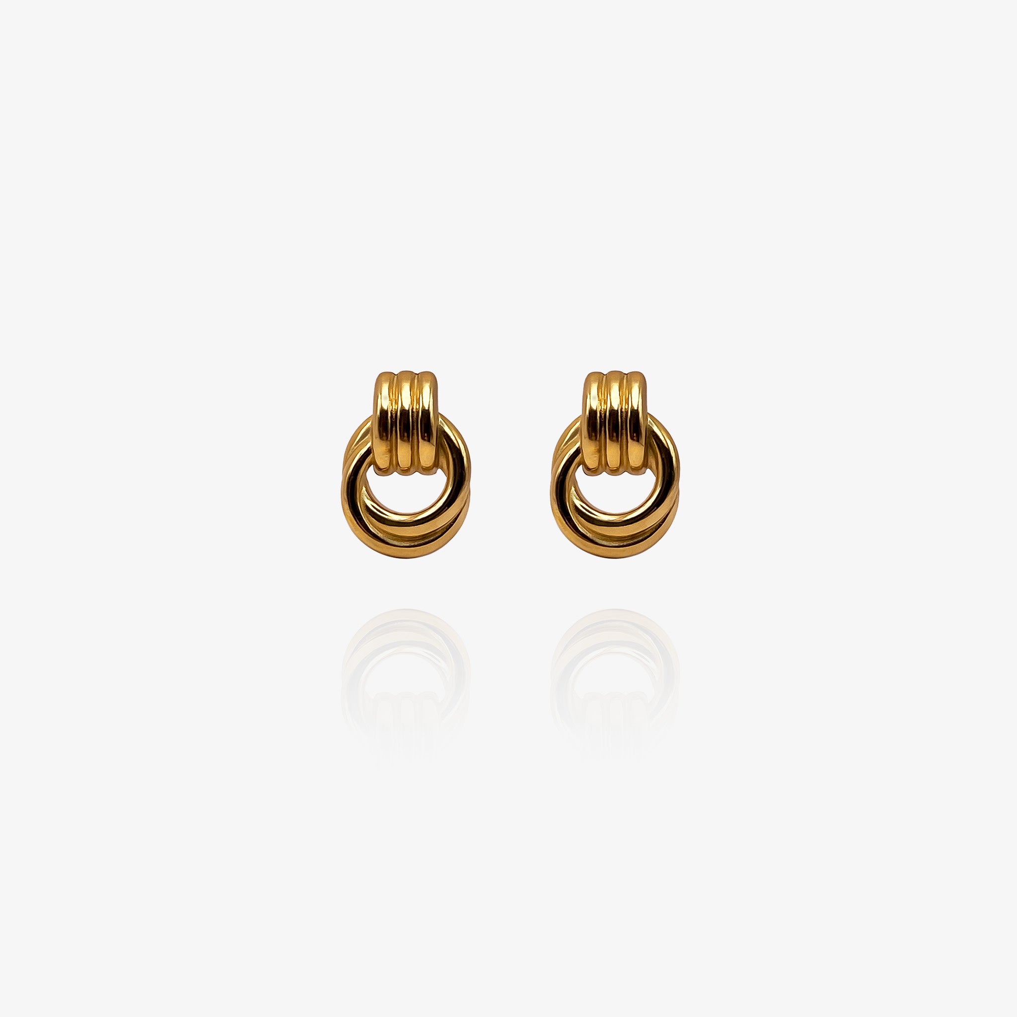 Pair of gold hoop earrings on a white background